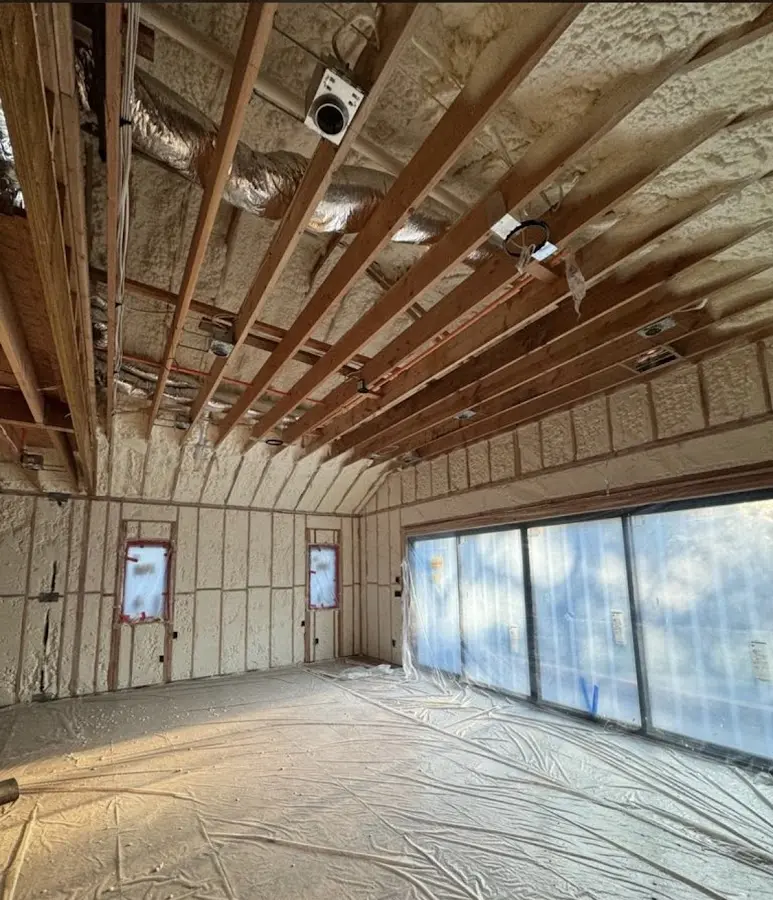 Interior walls and ceiling insulated with spray foam during new construction in Gunnison